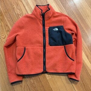 The North Face Orange Fleece Jacket with Black Chest Pocket